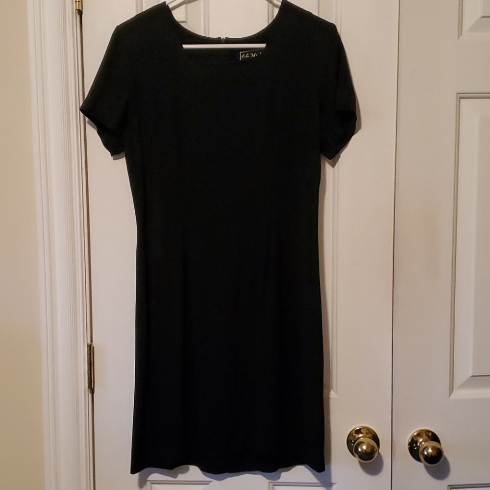Black, fitted, short-sleeved dress.